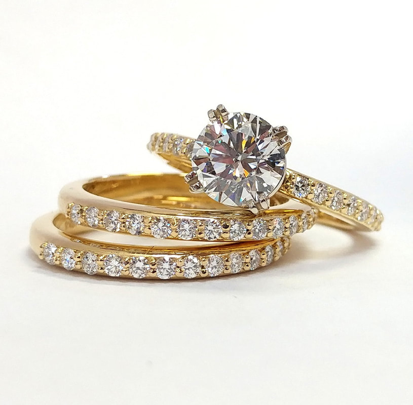 Wedding set featuring 14k yellow gold and bezel set Cognac diamonds